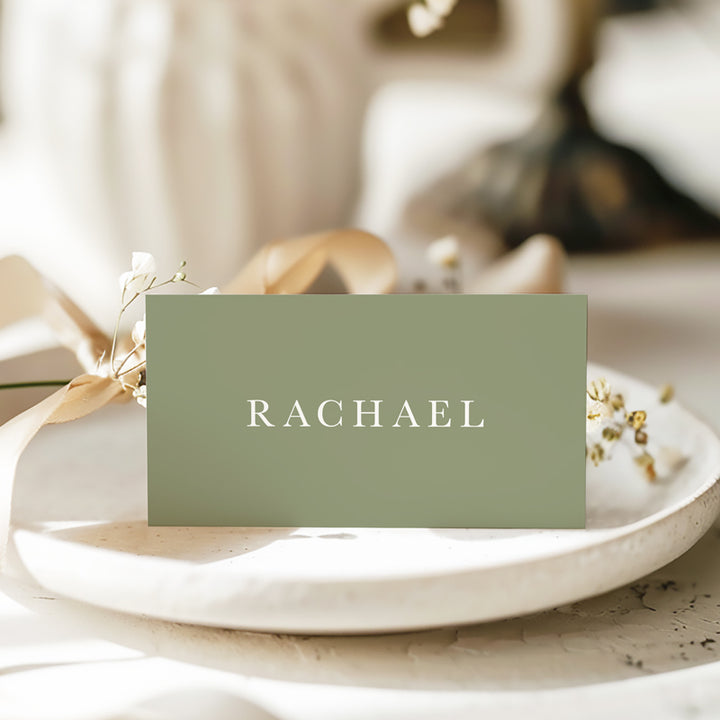 Folded wedding place cards or name cards with calligraphy font. White ink on green card. Printed in Australia.