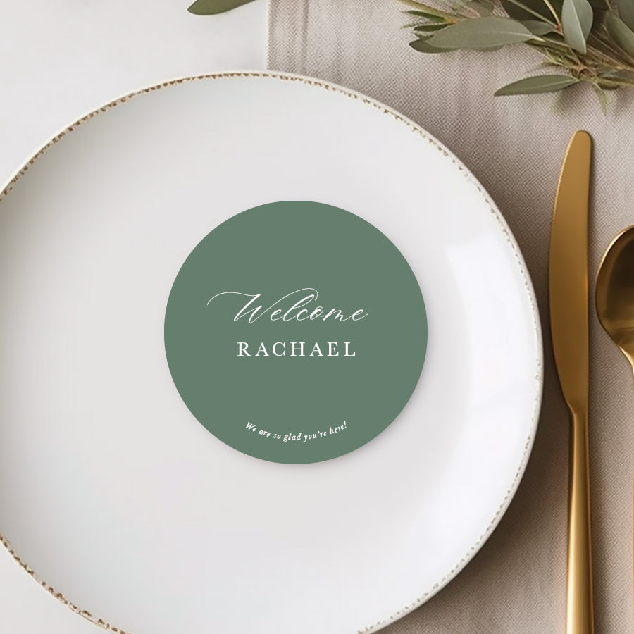 Round wedding place cards or name cards with calligraphy font. White ink on green card. Printed in Australia.