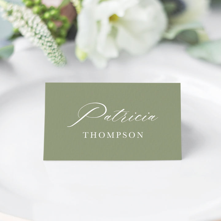 Folded wedding place cards or name cards with calligraphy font. White ink on green card. Printed in Australia.