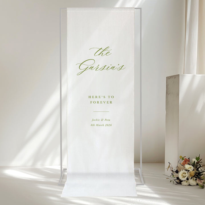 Modern calligraphy green and white linen wedding or event welcome sign with bride and grooms names. Printed in Australia.