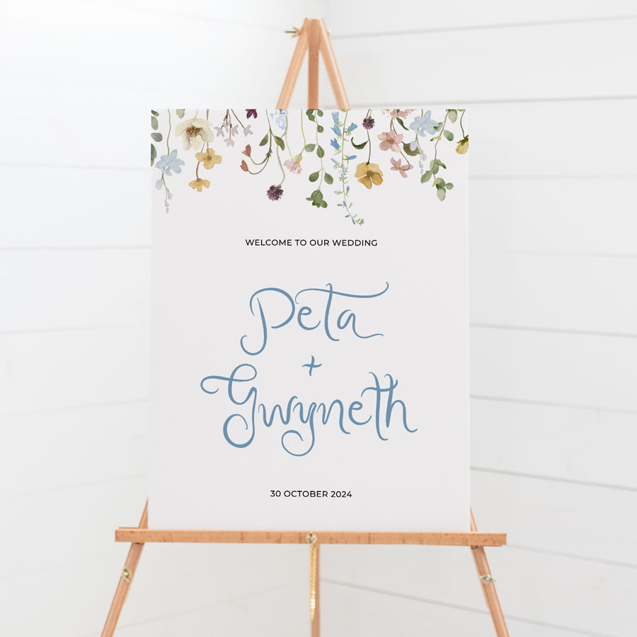 Wildflower wedding welcome sign with florals and hand written script font in blue. Print on foamboard or acrylic in Australia.