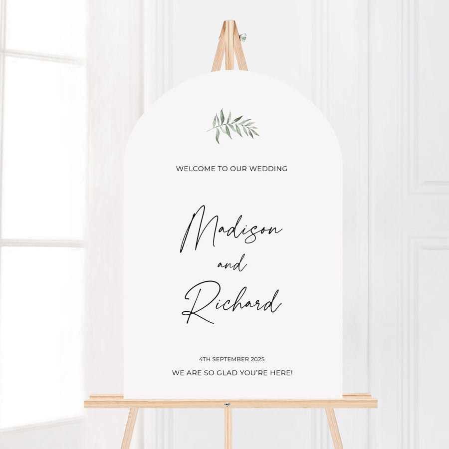 Modern wedding or event welcome sign with watercolour green leaf and calligraphy font. Designed and printed in Australia. Arch shape