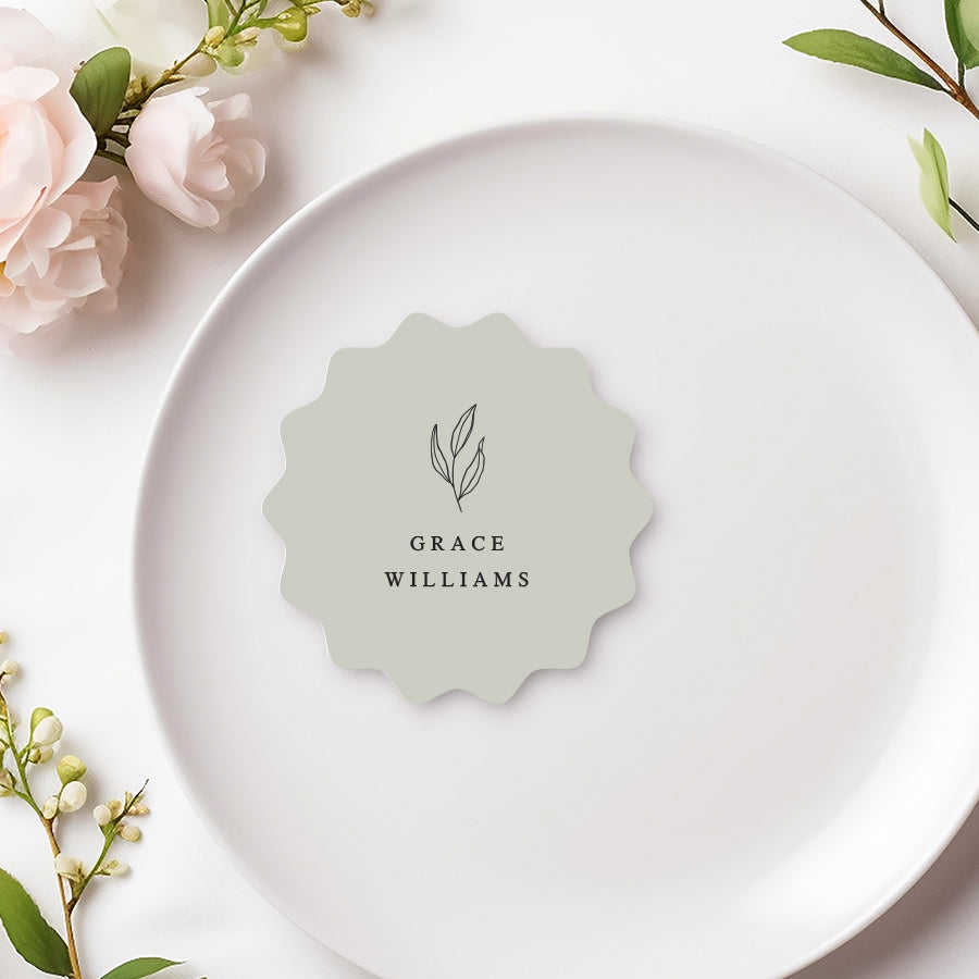 Wavy shape wedding or Baptism place card with hand drawn leaf in pale green. Printed in Australia.