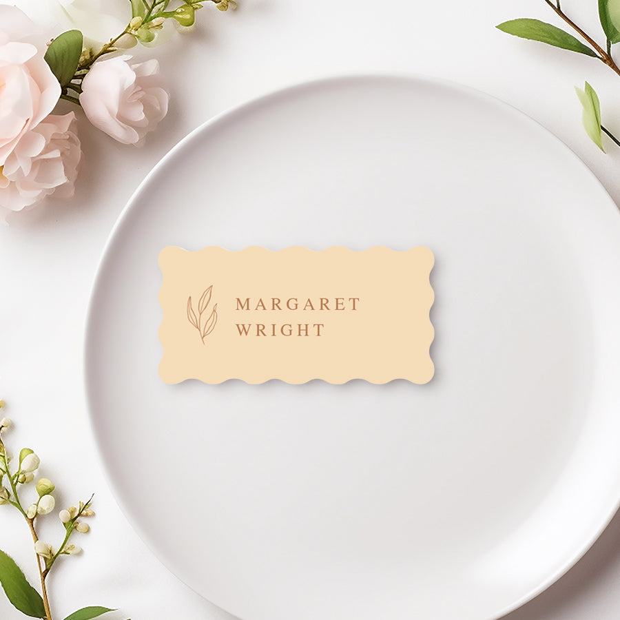 Wavy shape wedding or Baptism place card with hand drawn leaf in cream colour. Printed in Australia.