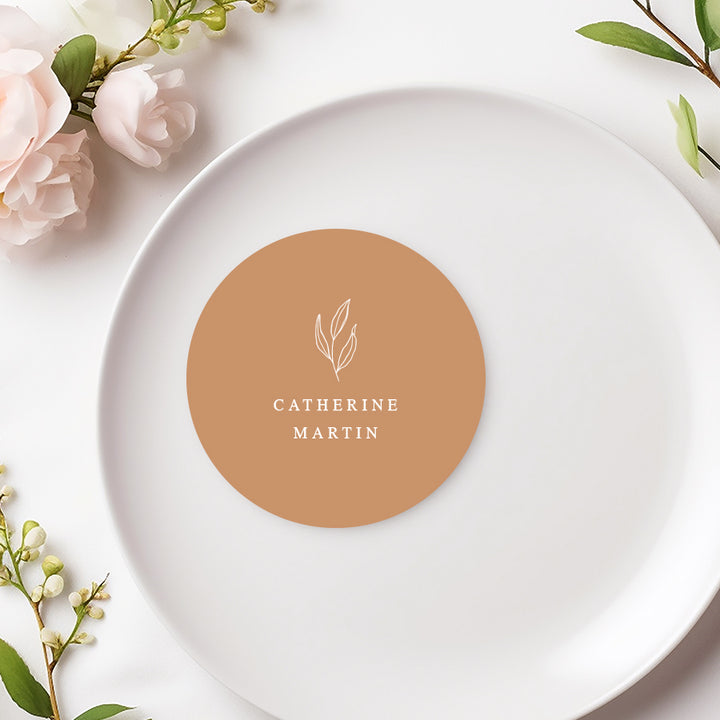 Round wedding or Baptism place card with hand drawn leaf in cinnamon colour. Printed in Australia.