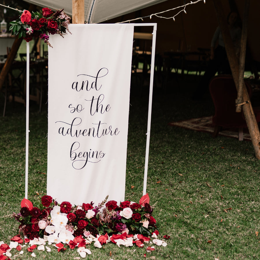 And so the adventure begins pure linen wedding welcome sign with burgundy florals.