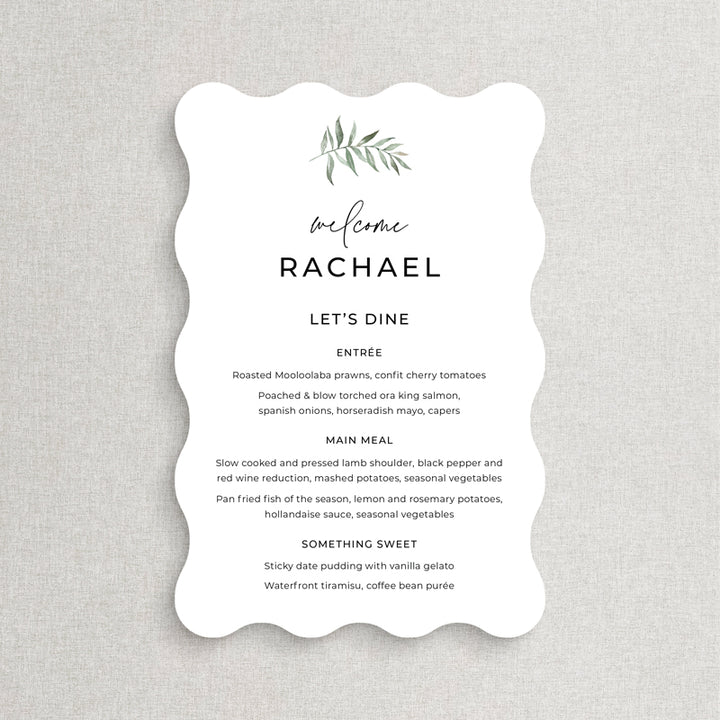 Wavy shape wedding menu with green watercolour leaf and modern calligraphy font. Guest names on each, printed in Australia.
