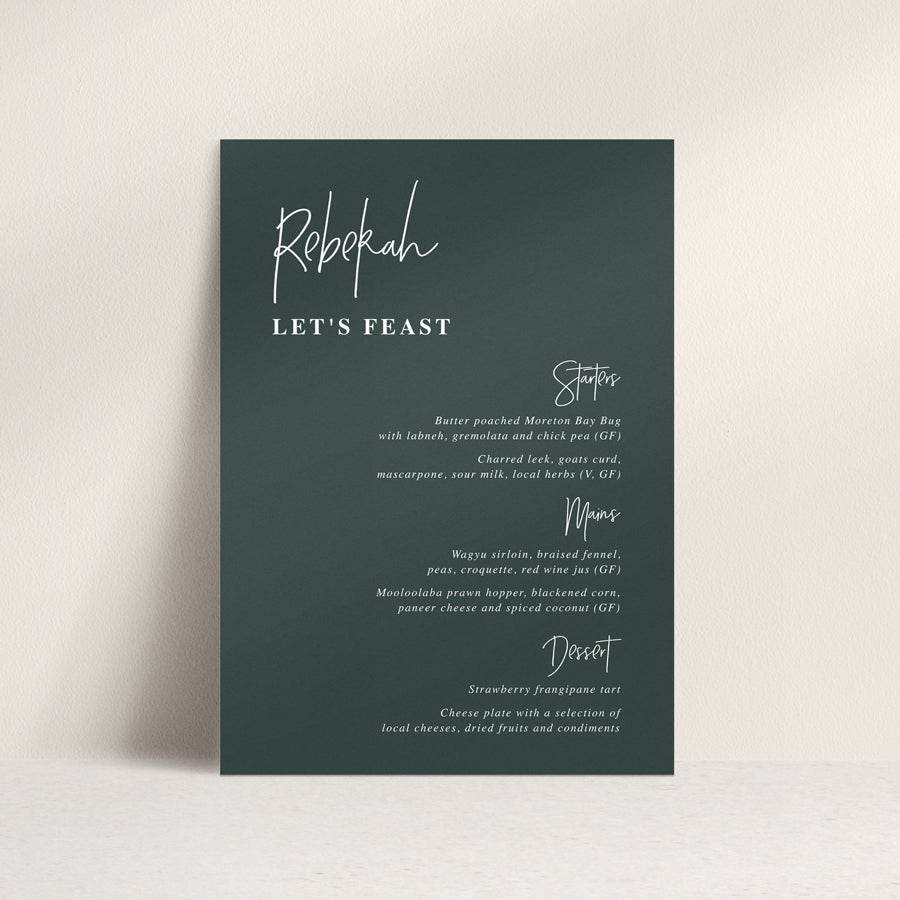 Modern wedding menu on deep green cardstock with white ink. Guest names on each menu and lets feast for heading.