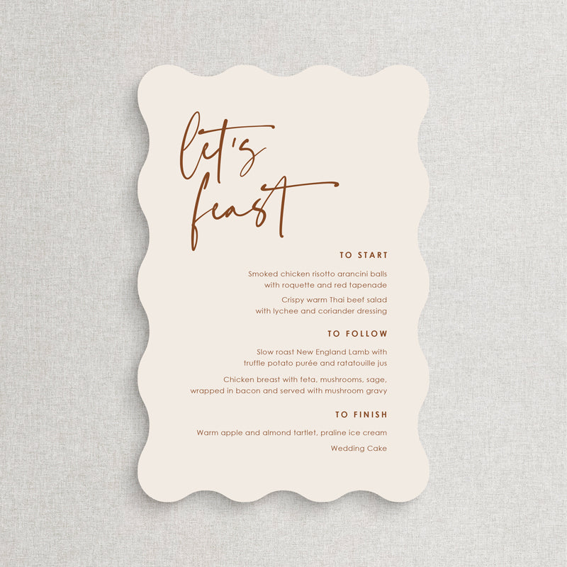 Wavy wiggle shape wedding menu on almond coloured card with terracotta text. Lets Feast. Printed in Australia.