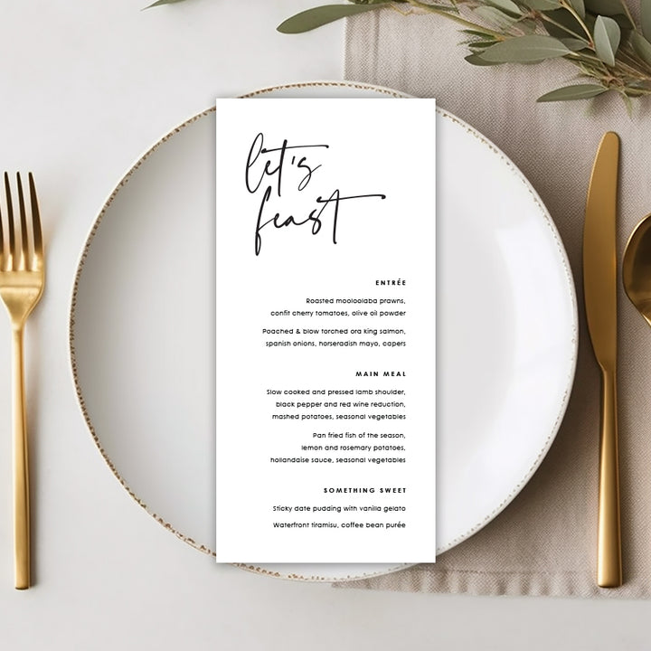 Modern wedding menu on dinner plate with lets feast heading in black and white monochrome. Peach Perfect Australia.