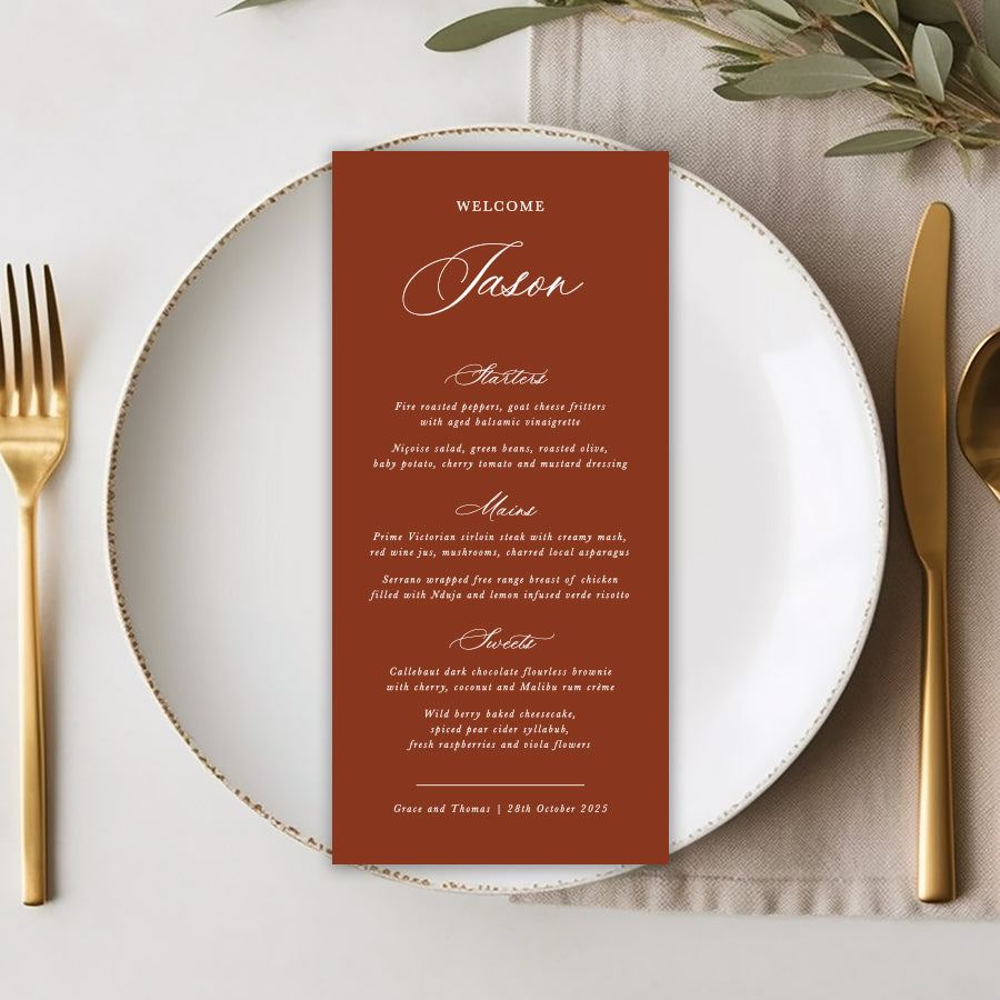 Elegant formal wedding menu on dinner plate with guest names printed on each in calligraphy. Terracotta and white. Designed in Australia.