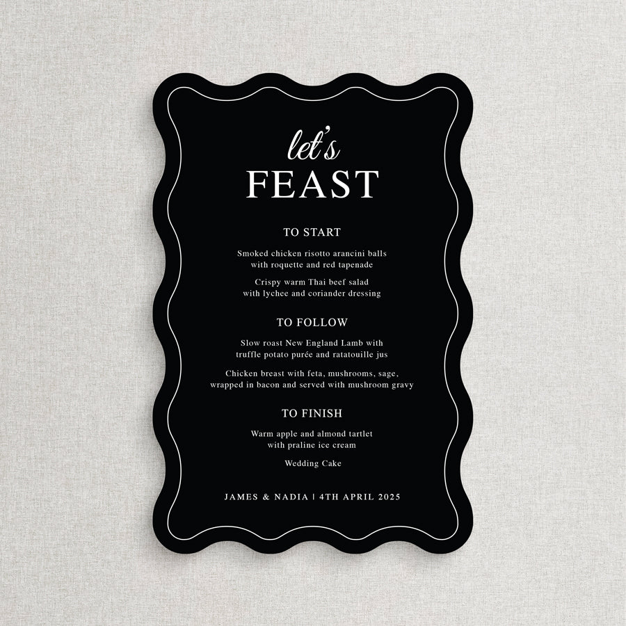 Modern black wedding menu with white ink die cut to wavy shape with lets feast heading.  Printed in Australia by Peach Perfect.