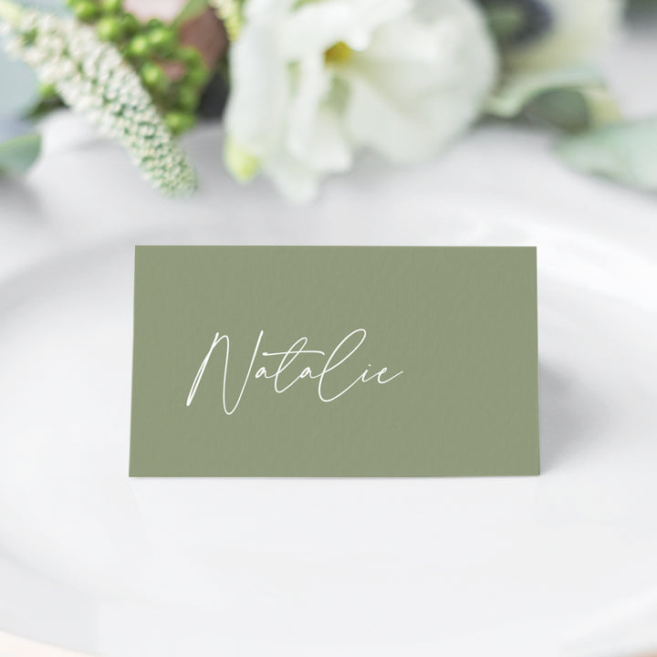 Folded wedding or event place card, white ink on green with calligraphy font. Peach Perfect Australia.